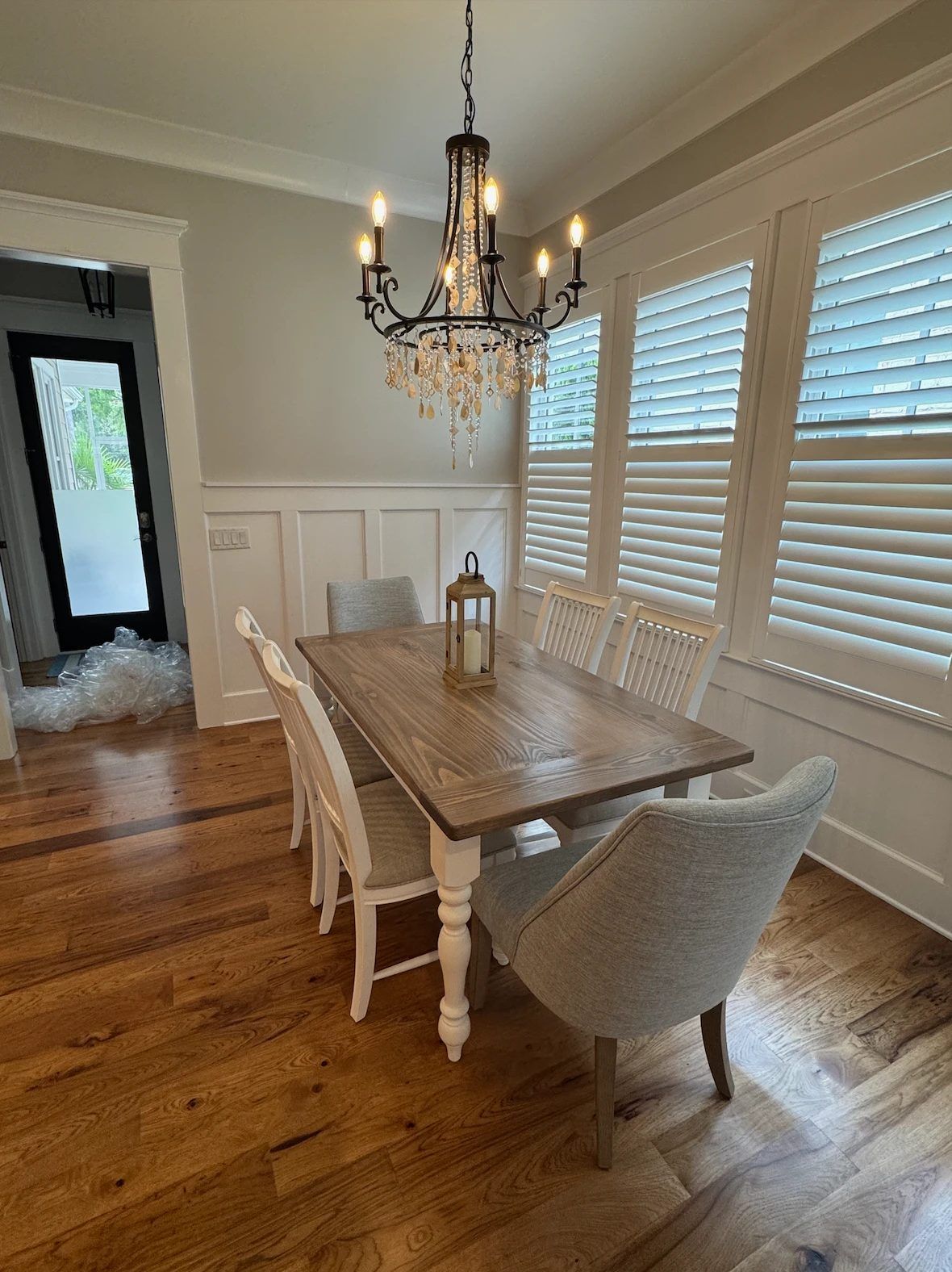Turned leg farmhouse table with white legs and a gray top